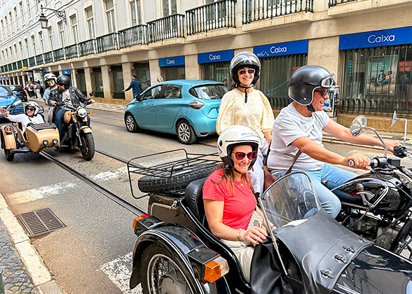 Visitors Ride Motorbikes in Lisbon Downtown Area